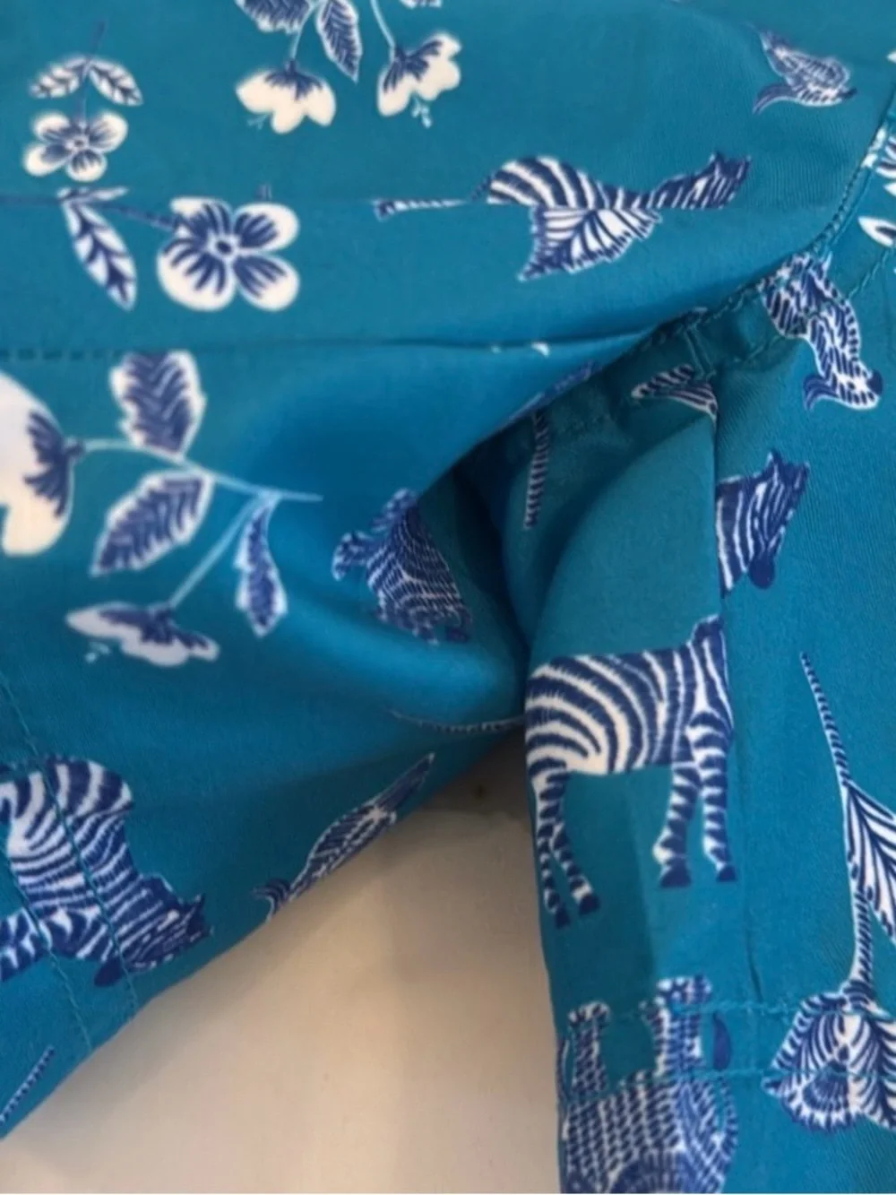 Janie and Jack Teal World Love Swim Trunks with Animal Print